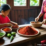 Home 18 전통 장류 자가 제조와 가족의 역할 - A vibrant traditional Malaysian kitchen scene featuring a family preparing sambal chili paste togeth...